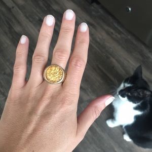 Gold cocktail ring with yellow stone